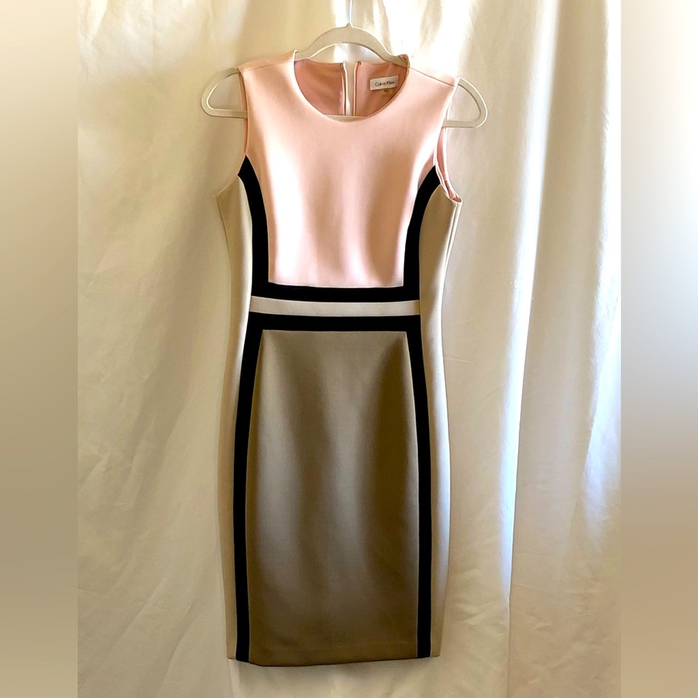 Calvin Klein Chic and innovative colorblocking decorates a sheath dress